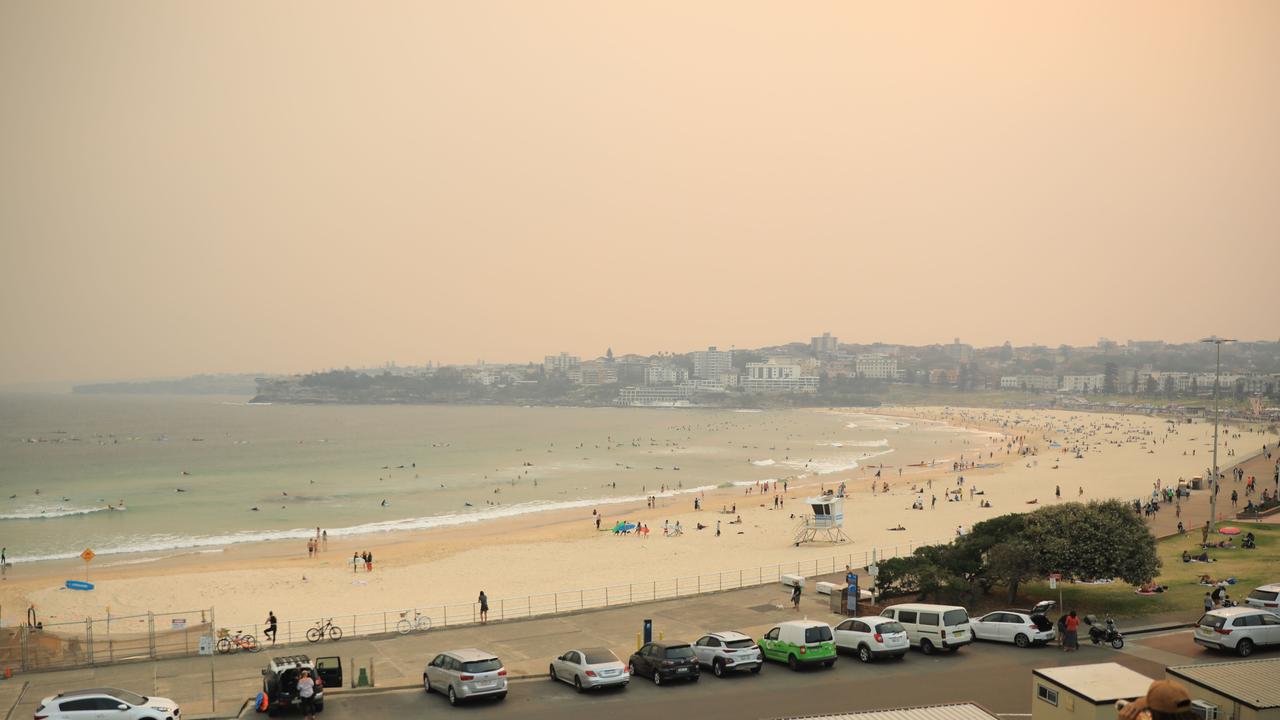 Eerie smoke diffused light over Bondi Beach. Picture: Christian Gilles