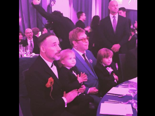 Elton John at Oscars 2015 party via Instagram, “The boys stop by for a visit in the sweetest little black tie dinner suits. They are so happy to see Uncle Neil on the big screen!!@Ejaf #Oscars”