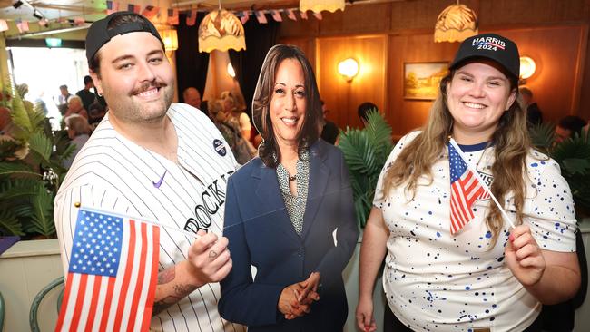 Democrat fans Matt Davids and Emily Kammerlohr with a cardboard cutout of Kamala Harris at the Kent St Hotel. Picture: Rohan Kelly