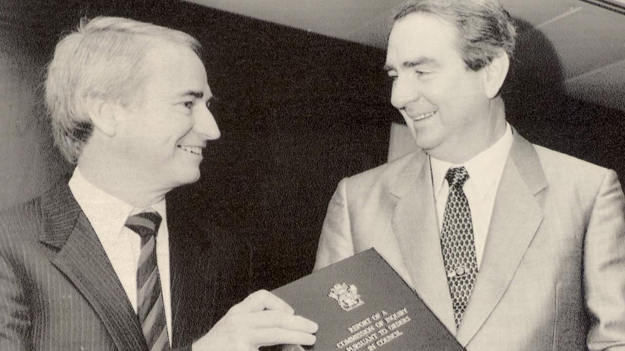 Tony Fitzgerald QC with then Premier Mike Ahern and the commission of inquiry report in 1989.