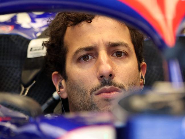 RB's Australian driver Daniel Ricciardo gets ready for the second practice session of the Formula One Australian Grand Prix at the Albert Park Circuit in Melbourne on March 22, 2024. Dani (Photo by Martin KEEP / AFP) / -- IMAGE RESTRICTED TO EDITORIAL USE - STRICTLY NO COMMERCIAL USE --