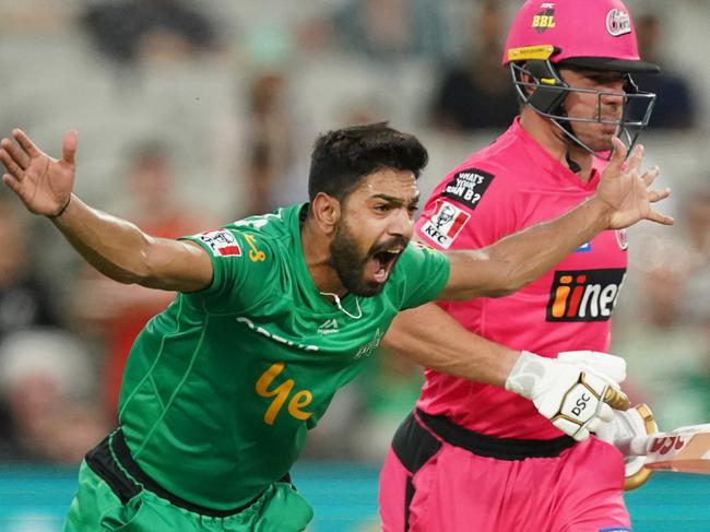 Harris Rauf of the Stars appeals for the wicket of Moises Henriques of the Sixers during the Big Bash League (BBL) cricket match between the Melbourne Stars and the Sydney Sixers at the MCG in Melbourne, Friday, January 31, 2020. (AAP Image/Michael Dodge) NO ARCHIVING, EDITORIAL USE ONLY, IMAGES TO BE USED FOR NEWS REPORTING PURPOSES ONLY, NO COMMERCIAL USE WHATSOEVER, NO USE IN BOOKS WITHOUT PRIOR WRITTEN CONSENT FROM AAP