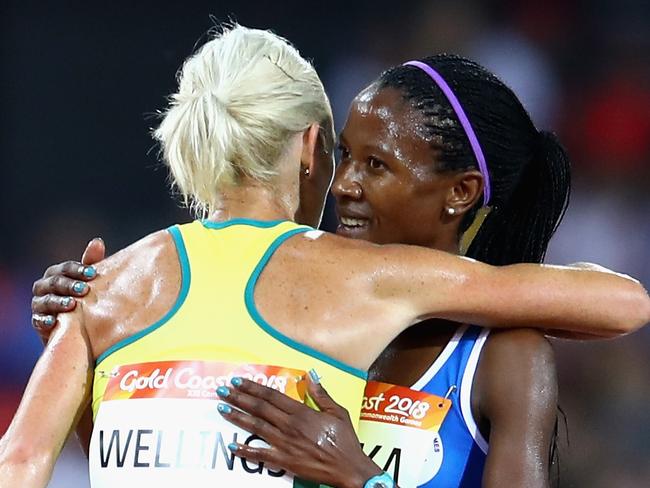 GOLD COAST, AUSTRALIA - APRIL 09:  Lineo Chaka of Lesotho is greeted by Eloise Wellings of Australia, Madeline Hills of Australia and Celia Sullohern of Australia as she finishes the Women's 10,000 metres final during the Athletics on day five of the Gold Coast 2018 Commonwealth Games at Carrara Stadium on April 9, 2018 on the Gold Coast, Australia.  (Photo by Mark Kolbe/Getty Images)