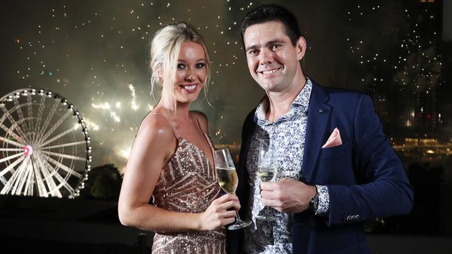 Elizabeth Gray, 21 and Brett Emery, 33, watching the fireworks in Brisbane. Picture: Liam Kidston.