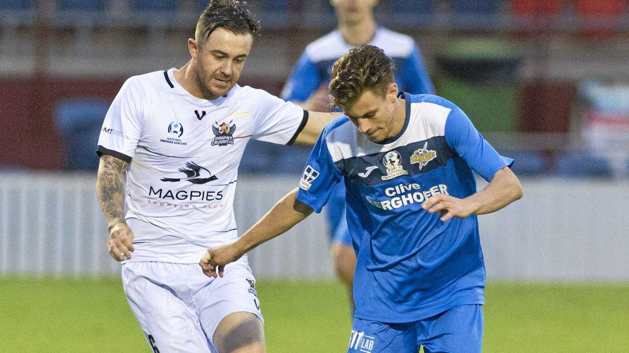 IN CONTROL: South West Queensland Thunder defender Wade Hall shields the ball from his Magpies Crusaders FC opponent. Picture: Kevin Farmer