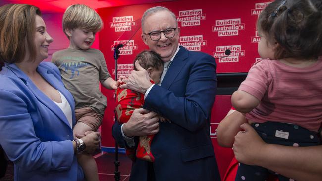 Anthony Albanese holds baby Maise, 3 months, after delivering a speech at the Morningside Panthers AFL club in Brisbane. Picture: NewsWire/Glenn Campbell