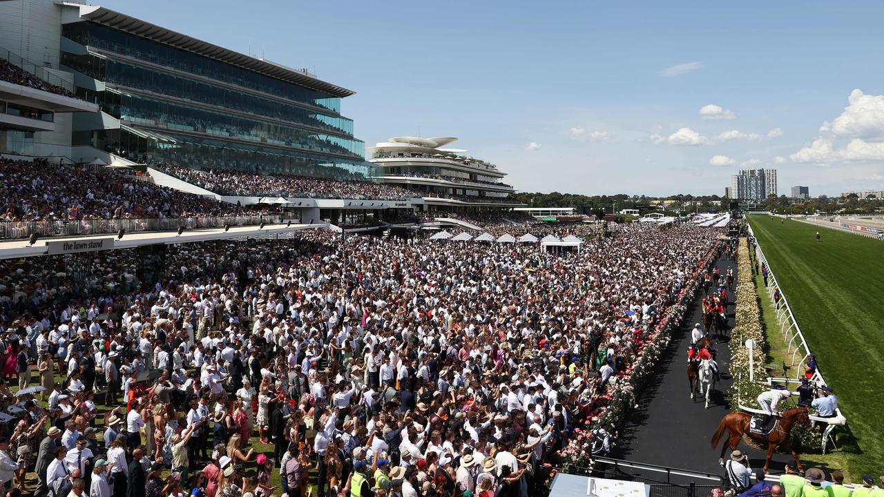 The field heads out for the Melbourne Cup in front of the huge crowd at Flemington Racecourse on Tuesday 7 November. Picture: Michael Klein