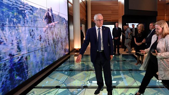 Malcolm Turnbull takes a look at an interactive exhibition during the official opening of the Sir John Monash Centre at Villers-Bretonneux. Picture: AAP.