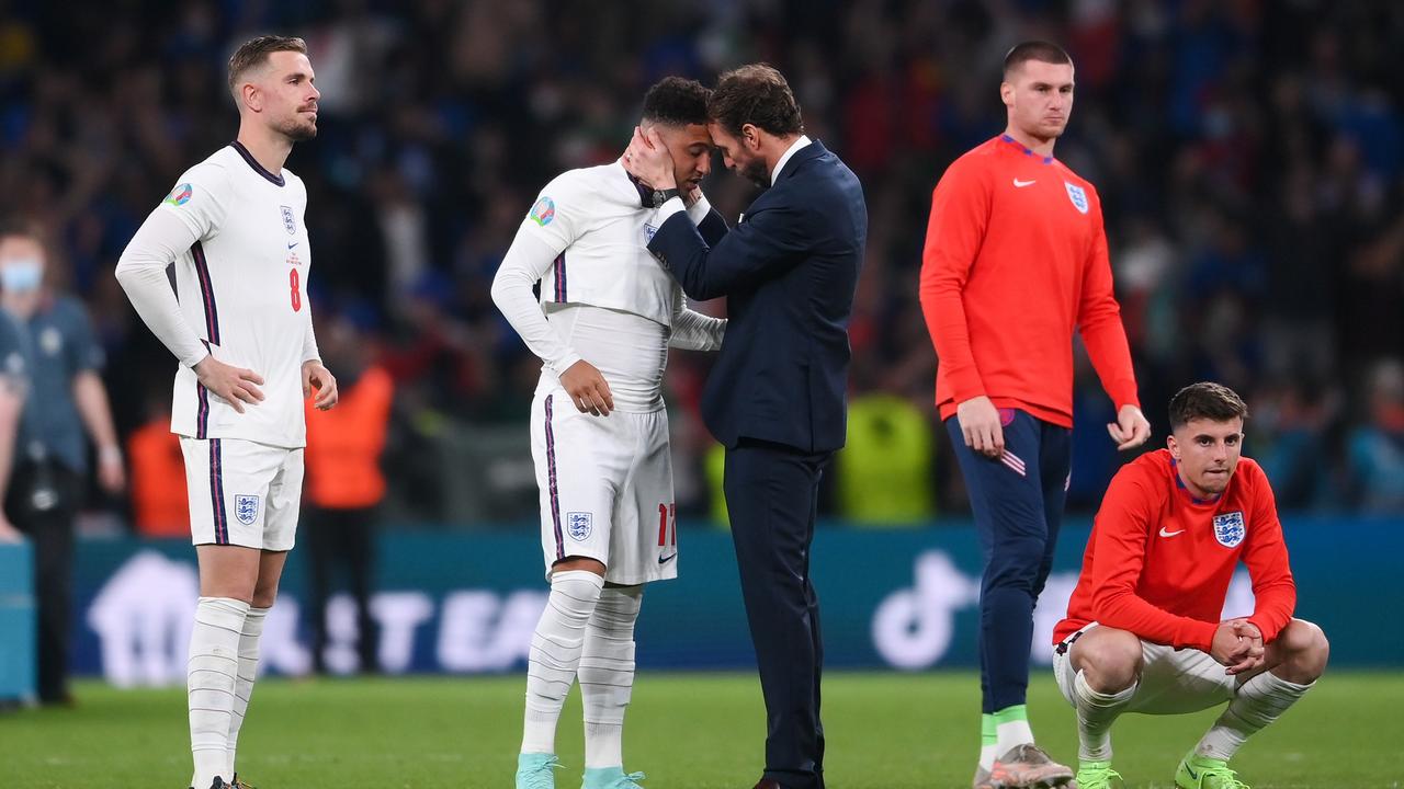 Southgate consoles Jadon Sancho after England were defeated in a nail-biting penalty shootout on Sunday. Photo: Laurence Griffiths/Getty Images