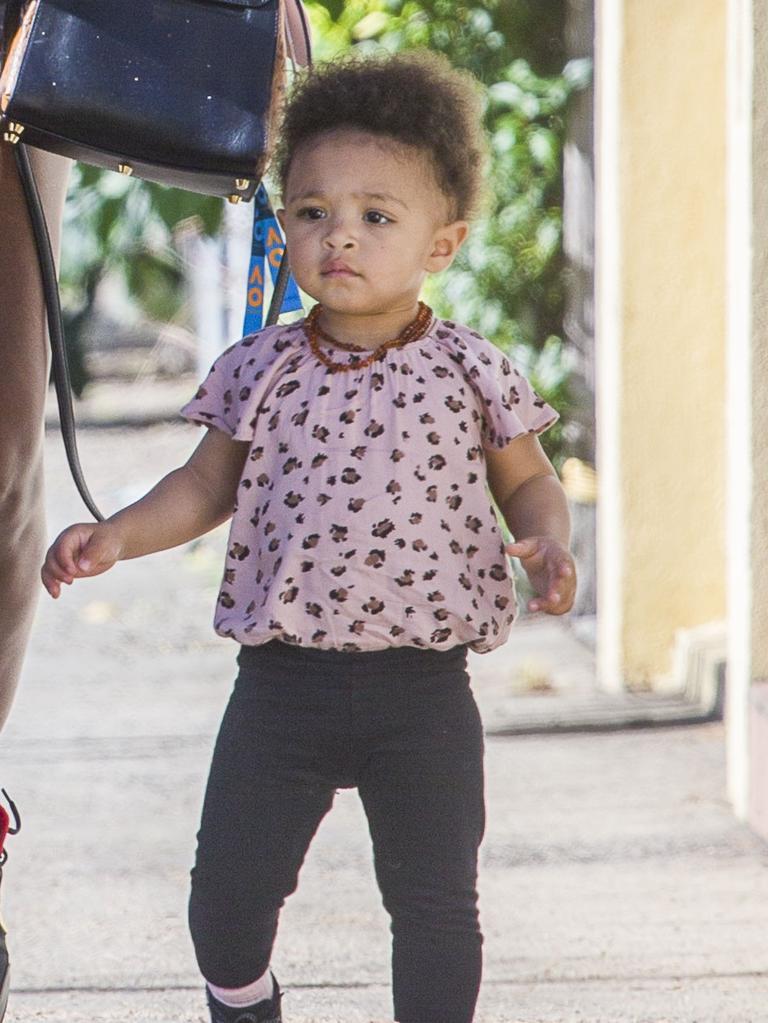 Serena Williams and her husband Alexis Ohanian enjoy an afternoon walk with their 1-year-old daughter Alexia Olympia. Serena's daughter looked seriously cute, toddling her way down the footpath, wearing Nike sneakers like her Mummy. Picture: MediaMode