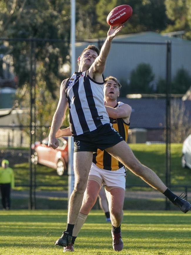 Hayden Dwyer and Upwey player Liam Beacom. Picture: Valeriu Campan