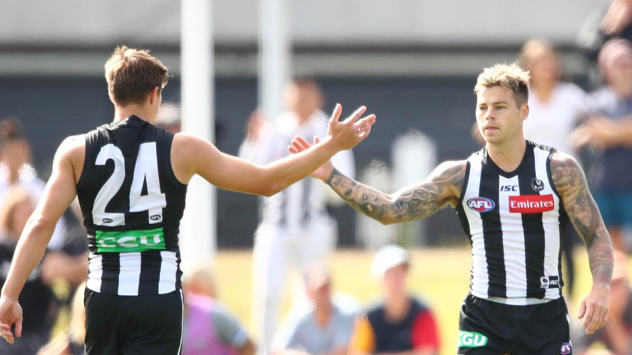 Jamie Elliott is congratulated by Josh Thomas after a goal