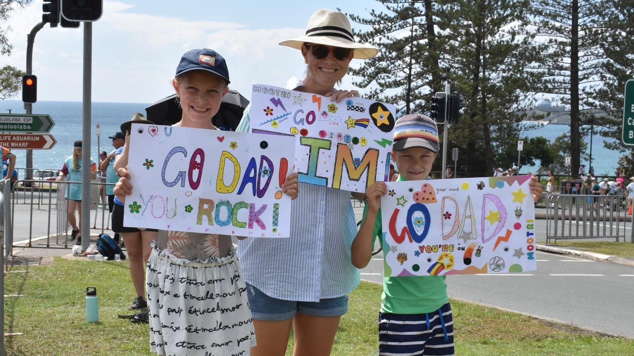 Kristi, Emma and Patrick Geddes cheering on Tim at the 2023 Mooloolaba Triathlon.