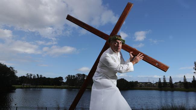 A member of the Sacred Heart parish rehearses his role as "Jesus", including a real crown of thorns, for the Stations of the Cross. Picture Glenn Hampson 