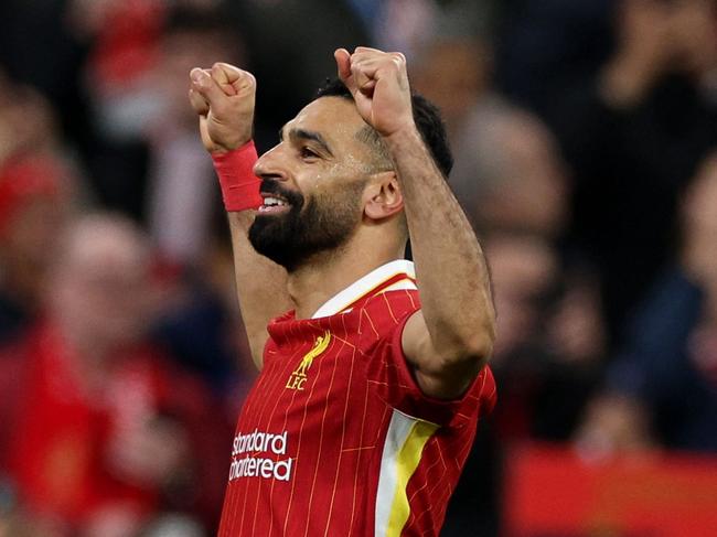 Liverpool's Egyptian striker #11 Mohamed Salah celebrates scoring the team's second goal during the English Premier League football match between Liverpool and Manchester City at Anfield in Liverpool, north west England on December 1, 2024. (Photo by Adrian Dennis / AFP) / RESTRICTED TO EDITORIAL USE. No use with unauthorized audio, video, data, fixture lists, club/league logos or 'live' services. Online in-match use limited to 120 images. An additional 40 images may be used in extra time. No video emulation. Social media in-match use limited to 120 images. An additional 40 images may be used in extra time. No use in betting publications, games or single club/league/player publications. /