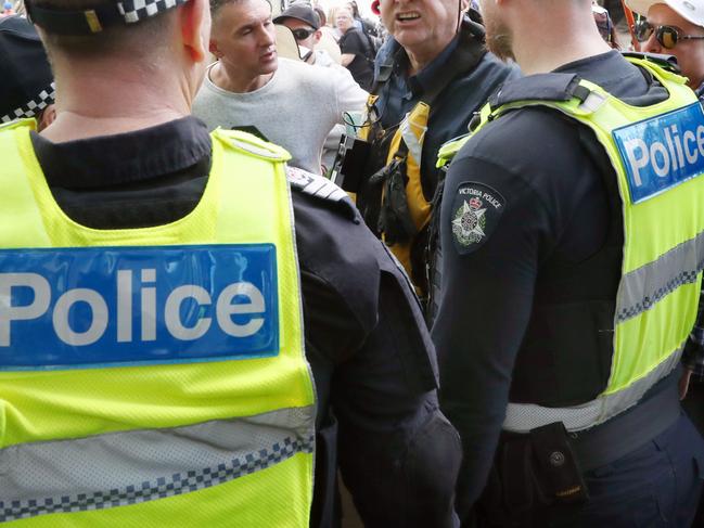MELBOURNE, AUSTRALIA - NewsWire Photos, AUGUST 27, 2022. A protester argues with police as 