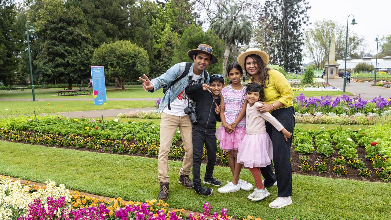 In Queens Park to view the floral display are Brisbane visitors Nisal Perera and Gaya Attygalle with kids Rivin, Dilitri and Ayudri for Carnival of Flowers 2022, Saturday, September 17, 2022. Picture: Kevin Farmer