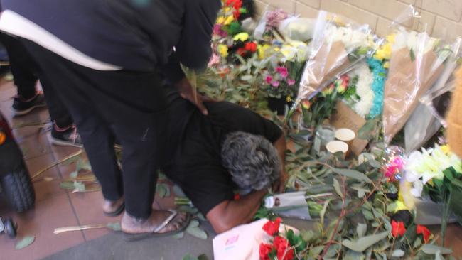 Family grieve during a vigil at Coles. Picture: Gera Kazakov