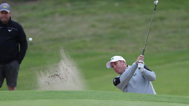 Mark Schulze hits out of a bunker during the men’s Australian Interstate Team’s tournament at Tasmania Golf Club last month. Picture: LUKE BOWDEN