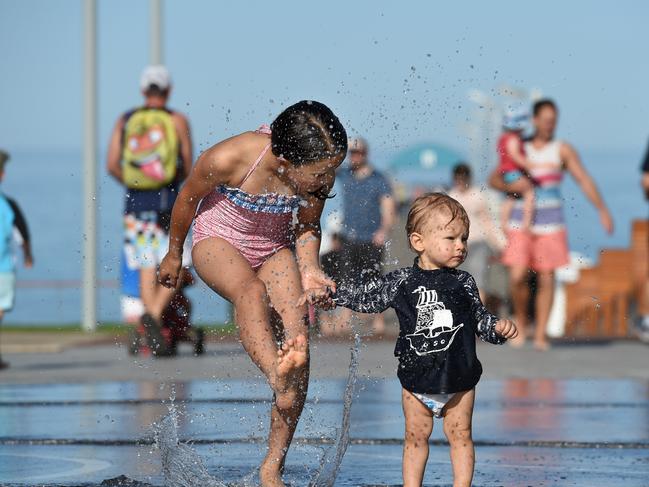 16/12/15 - Hot weather - Ruby Silverback, 10 with little brother Axel, 12 months (mum Andrea 0403438714 - would prefer no last name) trying out the water feature at the newly developed Henley Square. Photo Naomi Jellicoe