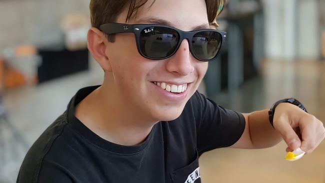 Cameron Duce who died after being allegedly bashed at Burleigh. He is photographed enjoying a mango while on a trip to north Queensland.