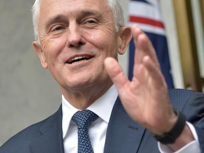 (FILES) A file photo taken on August 23, 2018 shows Australia's Prime Minister Malcolm Turnbull gesturing at a press conference at Parliament House in Canberra. - Dumped prime minister Turnbull will quit parliament this week, reports said on August 28, 2018, in another headache for Australia's rattled government which will temporarily lose its slim one-seat majority. (Photo by MARK GRAHAM / AFP)