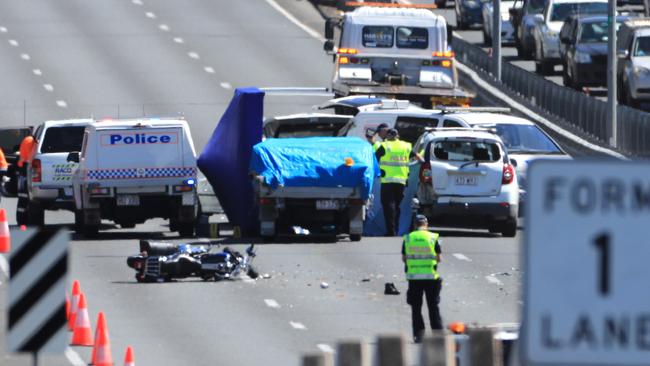 The Queensland Police Forensic Crash Unit investigate the scene of a fatal accident on the M1 at Exit 69 Nerang. Picture: Scott Powick