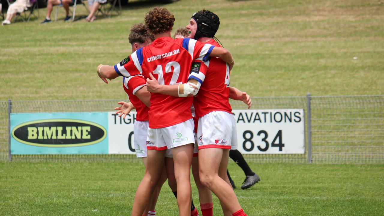 The Illawarra South Coast Dragons Andrew Johns Cup team celebrate a try. Picture: Kevin Merrigan