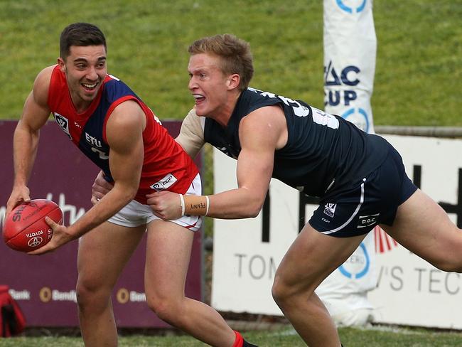 Jesse Corigliano tries to shrug clear of a tackle against Northern Blues. Picture: Hamish Blair