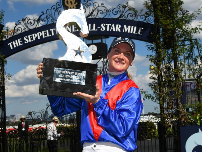 MELBOURNE, AUSTRALIA - MARCH 19: Jamie Kah poses with the All Star Mile trophy after riding Zaaki to win Race 6, the The Seppelt Wines All-star Mile, during All-Star Mile Race day at Flemington Racecourse on March 19, 2022 in Melbourne, Australia. (Photo by Vince Caligiuri/Getty Images)