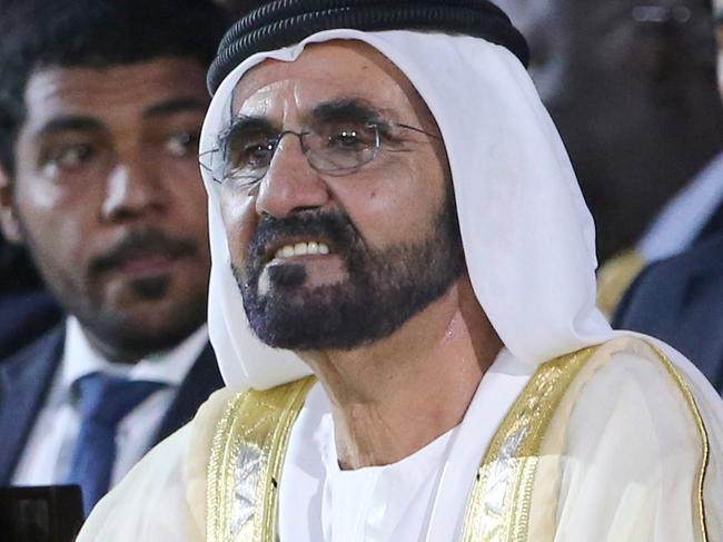 Vice President of the United Arab Emirates (UAE) and Emir of Dubai Sheikh Mohammed bin Rashid Al Maktoum (R) sits next to Uganda's President Yoweri Museveni during the opening of the Global Business Forum on Africa, in Dubai on November 1, 2017.   / AFP PHOTO / Karim SAHIB