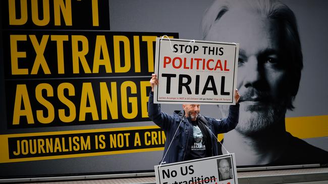 A demonstrator outside of the Old Bailey court in London. Picture: AFP