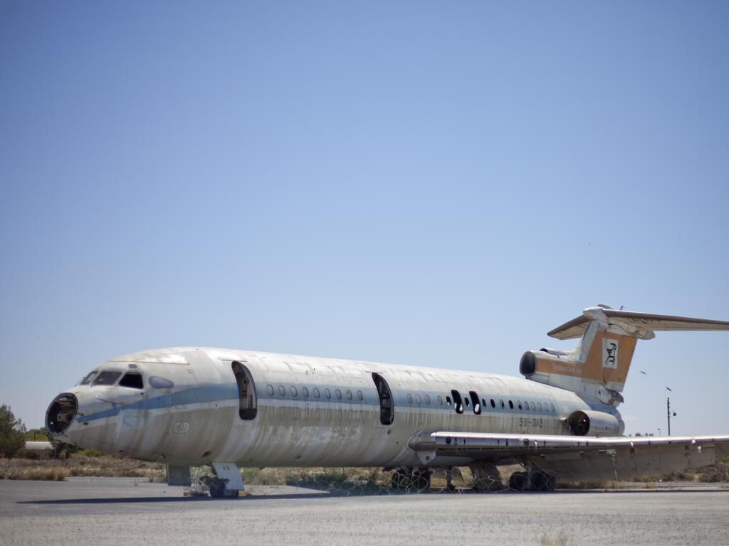 A gutted plane sits on the tarmac at Nicosia International Airport. Picture: Athanasios Gioumpasis/Getty Images