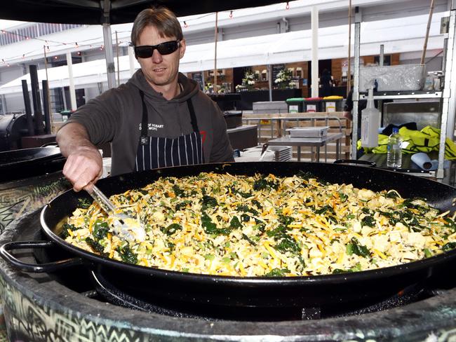 Hobart man Jay Harold cooking a monster paella.