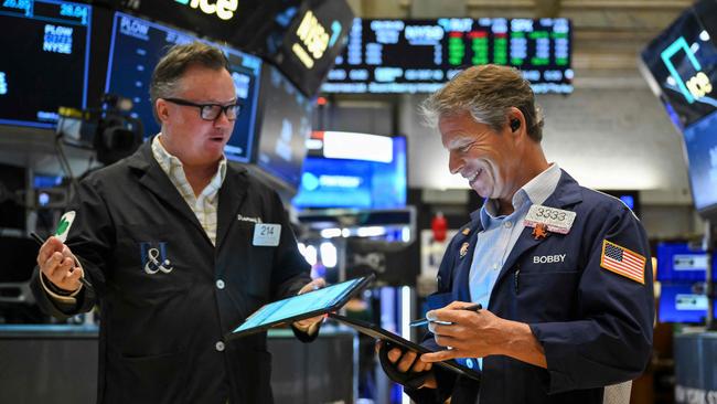 Traders work on the floor of the New York Stock Exchange (NYSE) at the opening bell on May 12, 2025, in New York City. (Photo by ANGELA WEISS / AFP)