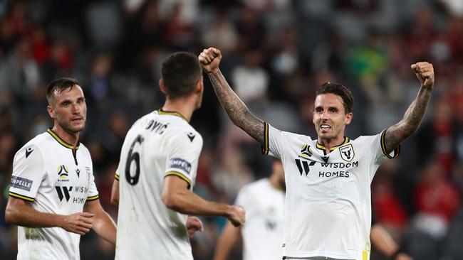 Macarthur FC striker Matt Derbyshire (right) celebrates with teammate Aleksandar Jovanovic (centre) after the Bulls’ win over Western Sydney Wanderers. Picture: Brendon Thorne/Getty Images