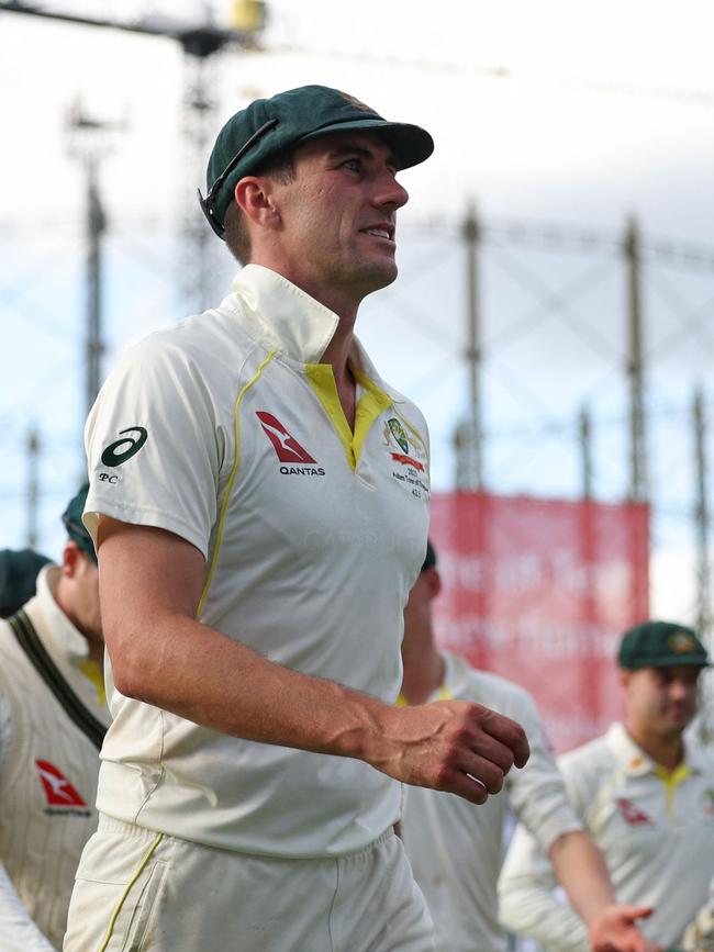 Australia's Pat Cummins leads his players in at the end of play. Picture: AFP