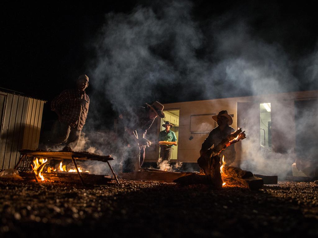 Cooking dinner during mustering at Macumba Station, Oodnadatta. Picture: Matt Turner.