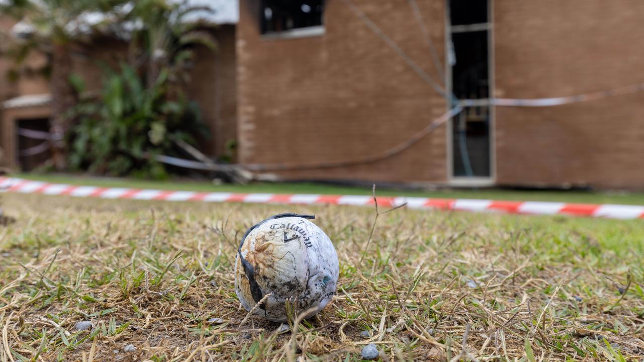 Burnt golf balls were found near the fire-ravaged house. Picture: Ben Clark