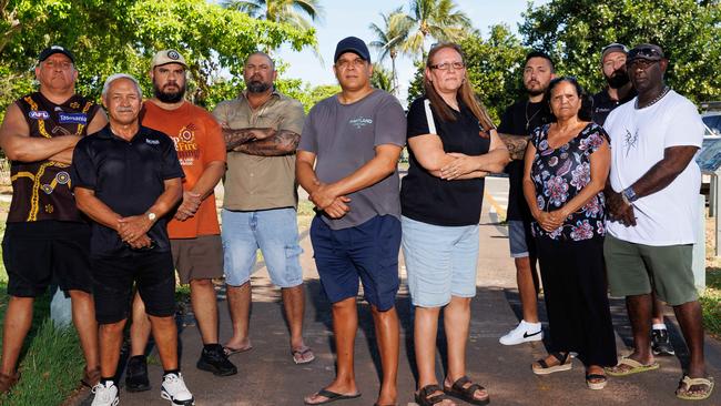 Shawn Lewfatt (centre left) and Lisa Burkenhagen (centre right) are two of the NT Aboriginal Community Police Officers who are taking the NT government and NT police commissioner to the Australian Human Rights Commission, claiming racial discrimination and racist conduct. Lewfatt and Burkenhagan are pictured here with other officers taking part in the legal challenge. Picture: Charlie Bliss