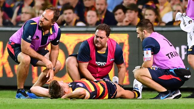 Paul Seedsman after landing awkwardly on his knee. Picture: Mark Brake/Getty Images