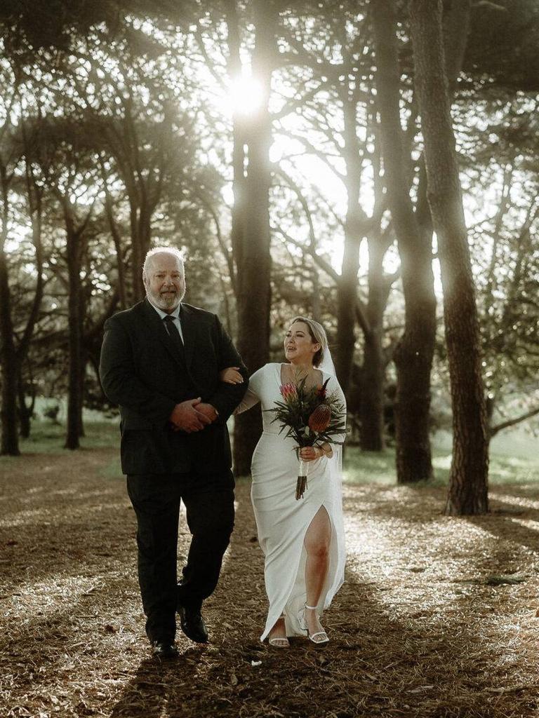 Raychel Stuart was walked down the aisle by her new mother-in-law’s partner, John. Picture: Candid Chaser Photography