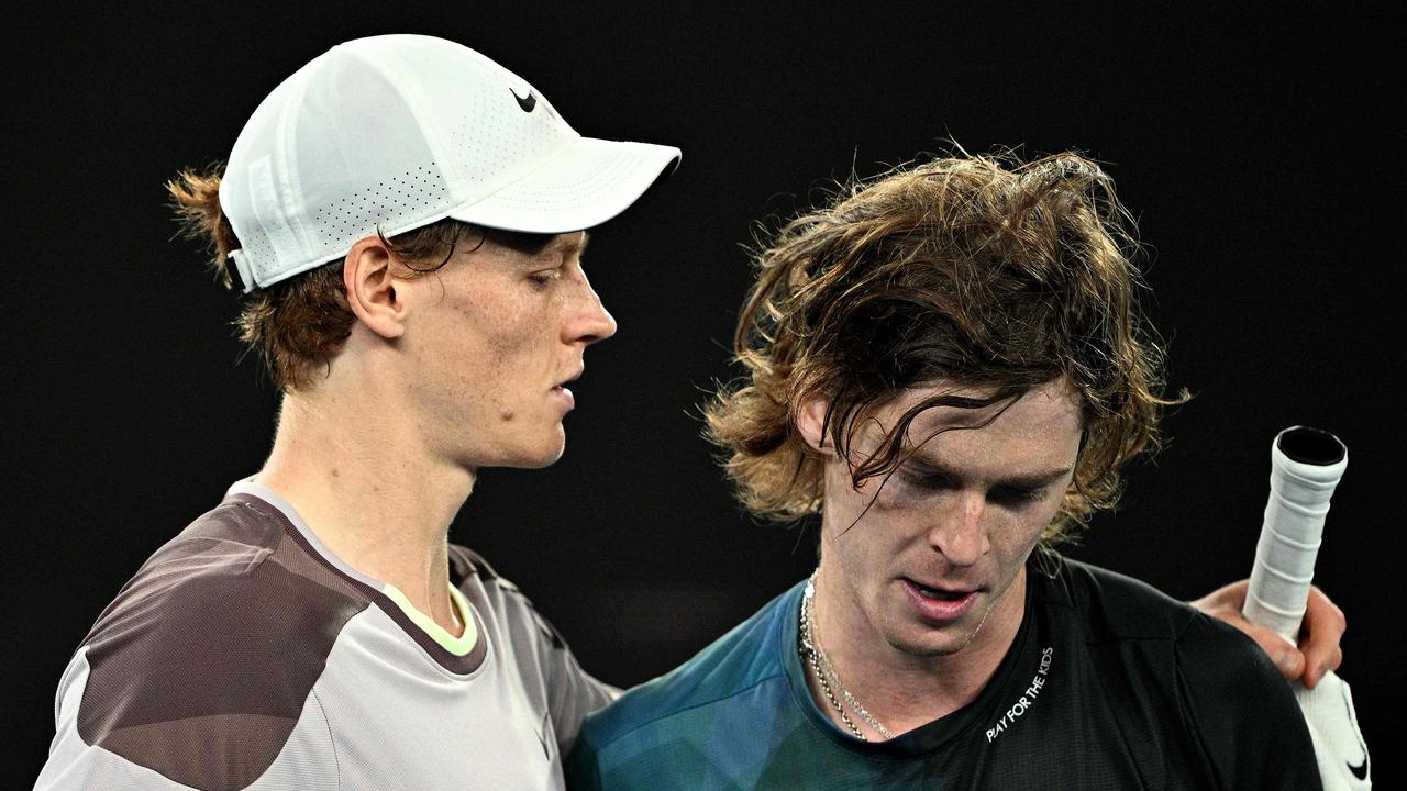 Sinner consoles Rublev, who lost his 10th grand slam quarterfinal. Photo by Anthony WALLACE / AFP