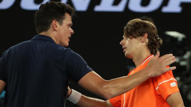 Canadian Milos Raonic congratulates Alex De Minaur, right, after he was forced to retire from their match. Picture: David Caird