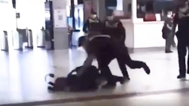 Footage aired online showed a police officer grab a man from behind and slam him on to the floor of the station.