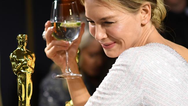 TOPSHOT - US actress Renee Zellweger waits for her award for Best Actress in a Leading Role for "Judy" to be engraved as she attends the 92nd Oscars Governors Ball at the Hollywood & Highland Center in Hollywood, California on February 9, 2020. (Photo by VALERIE MACON / AFP)