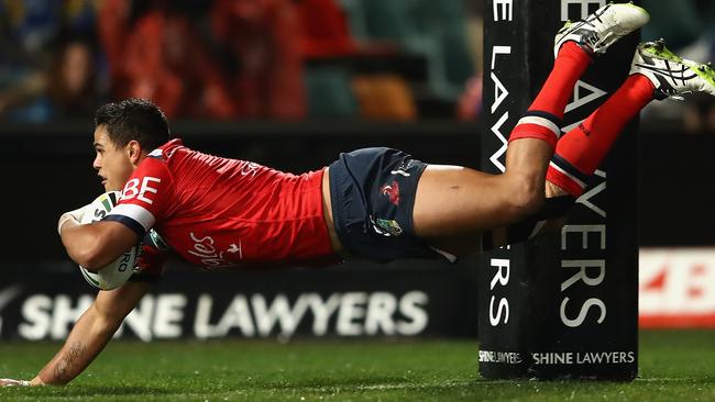 Latrell Mitchell scores a try for the Roosters.