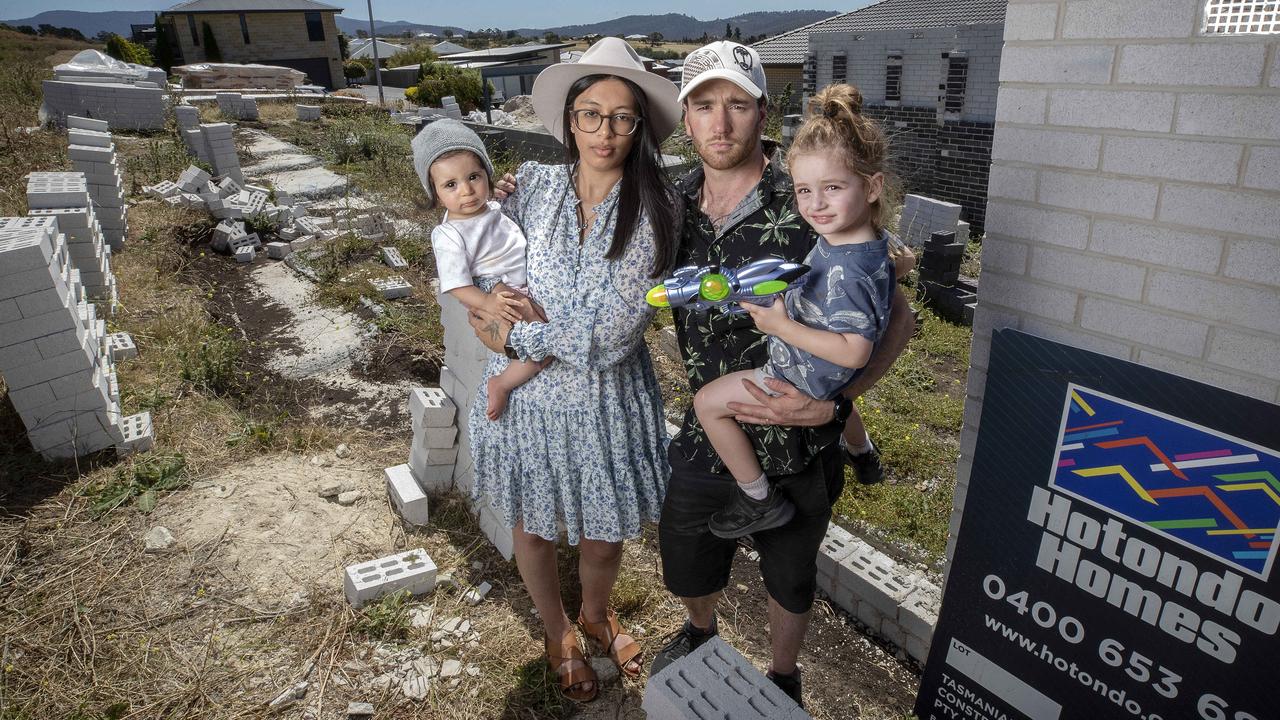 Roxy and Lachy Goss with their children Nya, 15 months, and Ry, 3 years, at their unfinished home at Granton. Picture: Chris Kidd