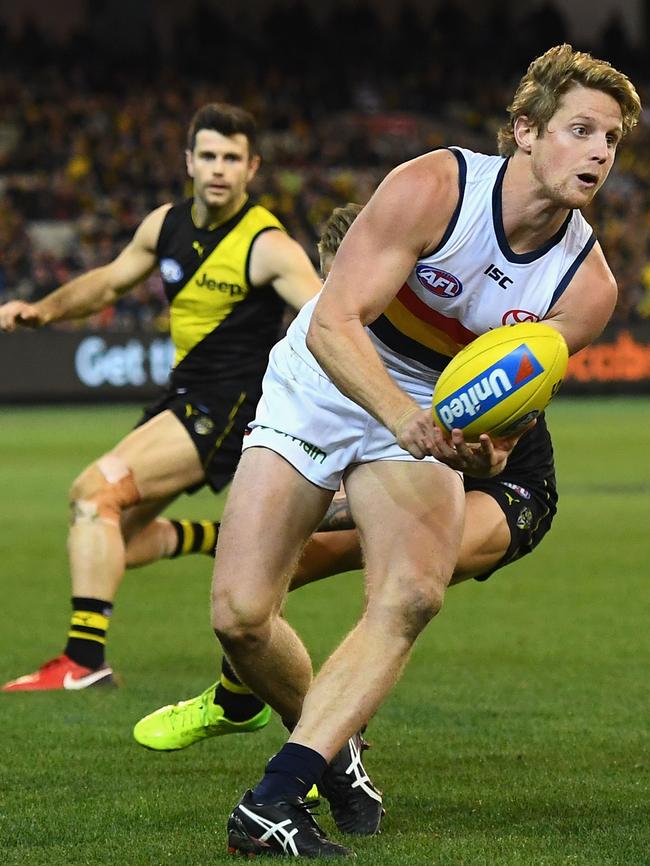 Rory Sloane handballs against Richmond on Friday night. Picture: Quinn Rooney/Getty Images