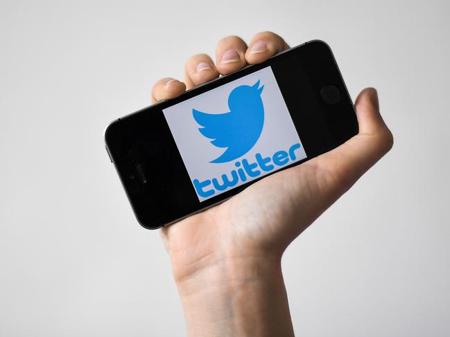 (FILES) In this file photo taken on May 02, 2019 a woman shows a smartphone with the logo of US social network Twitter, in Nantes, western France. - Twitter said March 4, 2020 it is testing a way for users to "think aloud" with tweets that vanish after a day instead of having posts linger. The ability to send ephemeral tweets called "Fleets" is being tried out in Brazil, according to the San Francisco-based social media platform. If more widely implemented, Twitter would match the disappearing posts first made popular by Snapchat and later adopted by Facebook and other platforms. (Photo by LOIC VENANCE / AFP)